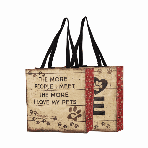 Beige tote bag with red side panels with text 'The more people I meet, the more I love my pets' and paw print designs.