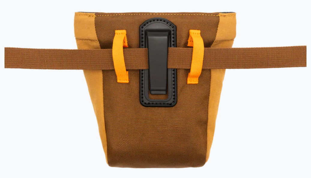 Brown bag with orange straps and a black buckle on a white background