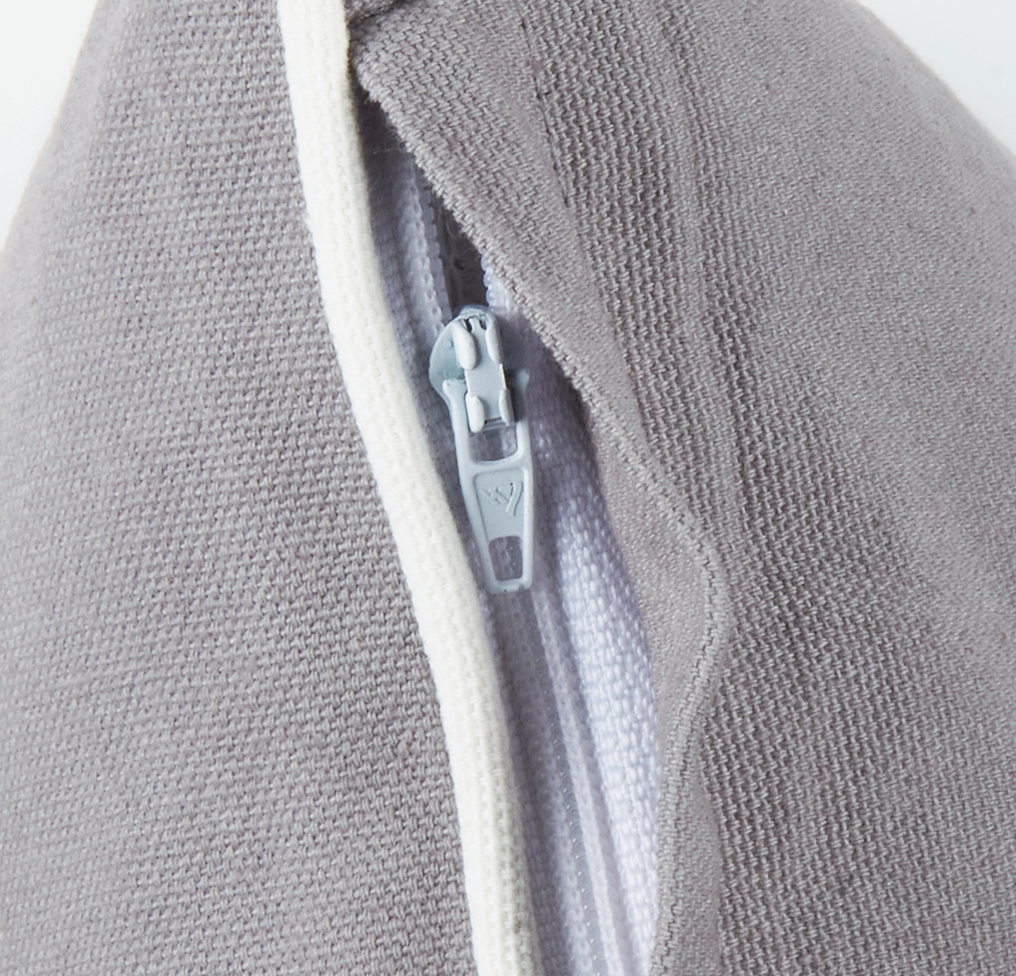 Close-up of a gray fabric with a zipper 